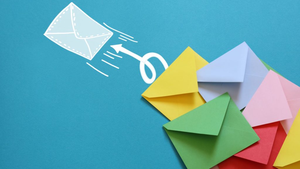 Email marketing depicted with envelopes being sent