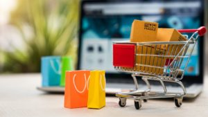 Tiny trolley sitting in front of a laptop